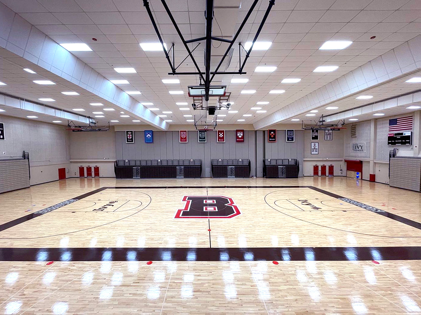 Primary B wordmark on the floor of the University gym.